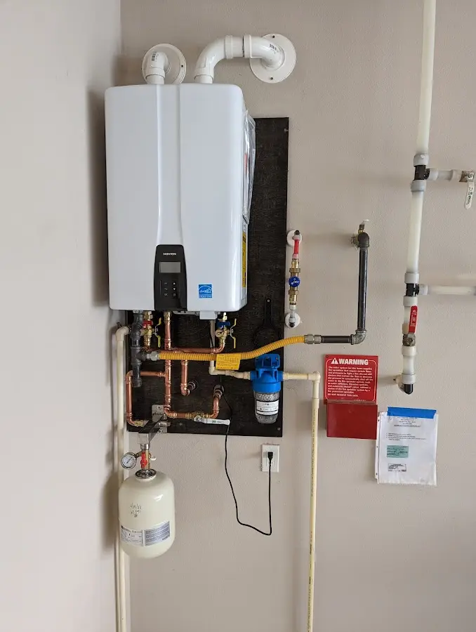 Professional plumber installing copper piping in a Strawberry Plains home